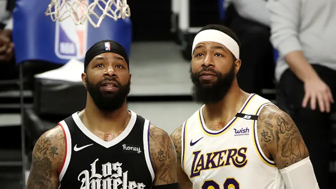 LOS ANGELES, CALIFORNIA - APRIL 04: Markieff Morris #88 of the Los Angeles Lakers and Marcus Morris Sr. #8 of the Los Angeles Clippers look on during the game at Staples Center on April 04, 2021 in Los Angeles, California. (Photo by Katelyn Mulcahy/Getty Images)